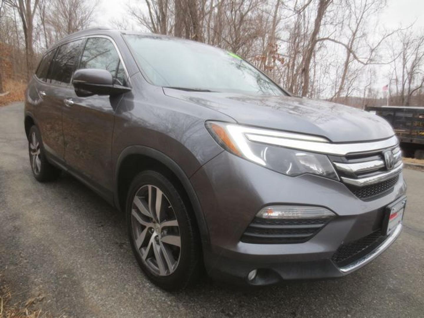 2016 Gray /Black Honda Pilot Touring 4WD (5FNYF6H9XGB) with an 3.5L V6 SOHC 24V engine, 9-Speed Automatic transmission, located at 270 US Route 6, Mahopac, NY, 10541, (845) 621-0895, 41.349022, -73.755280 - Photo#1