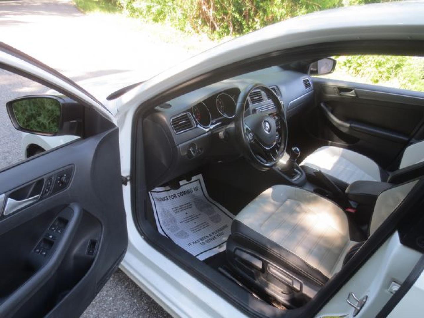 2016 White /White/Black Volkswagen Jetta SE (3VWB17AJ5GM) with an 1.8L L4 DOHC 20V engine, 5 Speed Manual transmission, located at 270 US Route 6, Mahopac, NY, 10541, (845) 621-0895, 41.349022, -73.755280- Photo#6